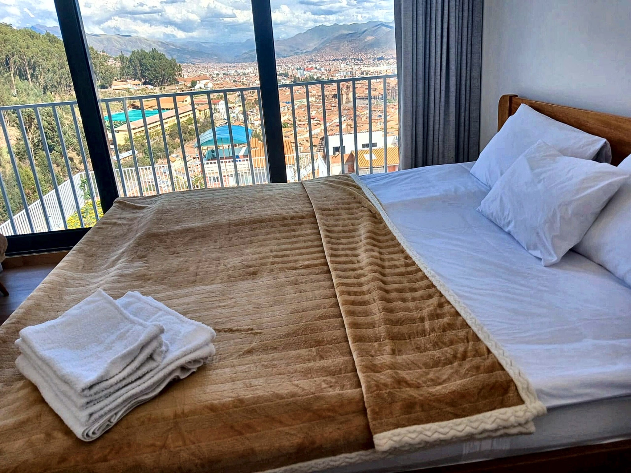 Master bedroom framed by the full Cusco panorama