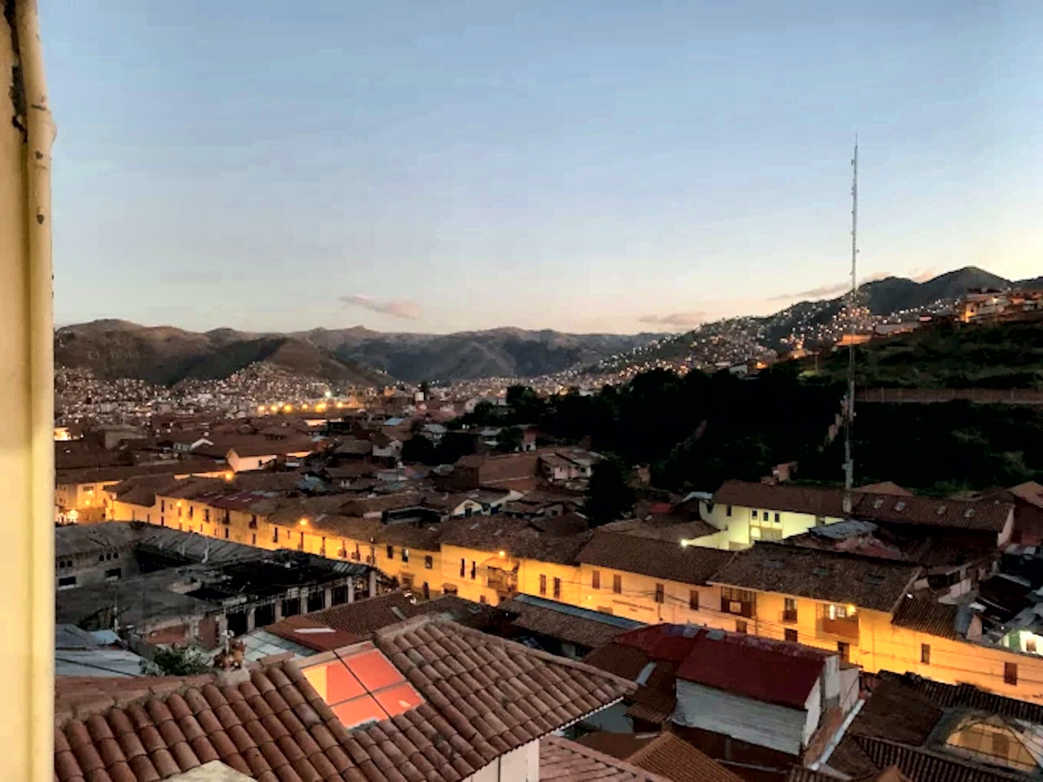 Sunset over Cusco's tiled rooftops