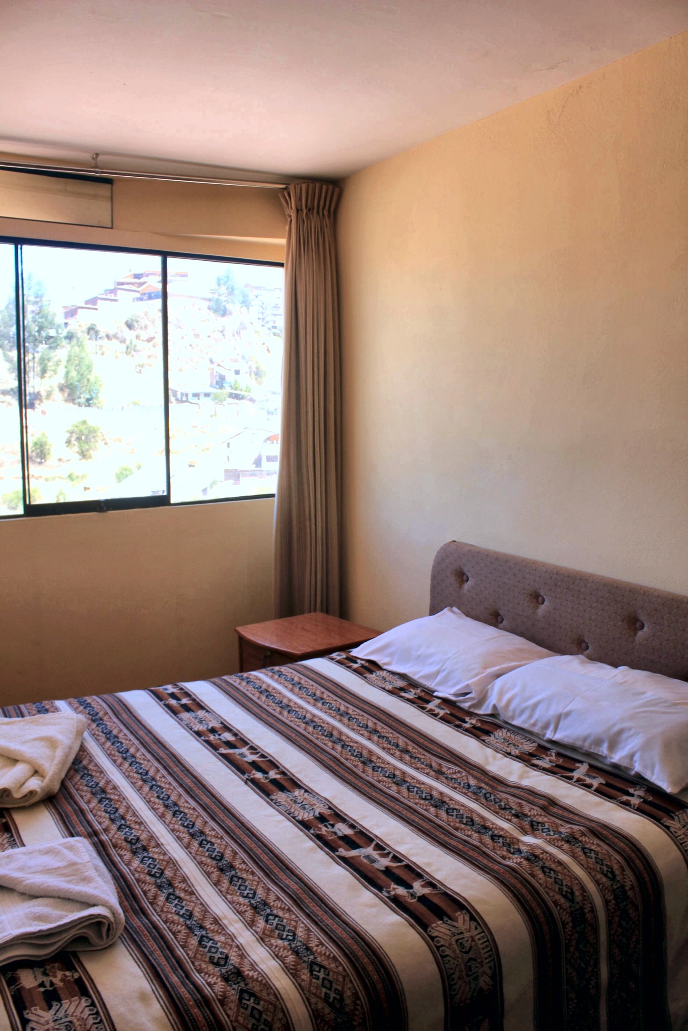 Bedroom with rooftop window view