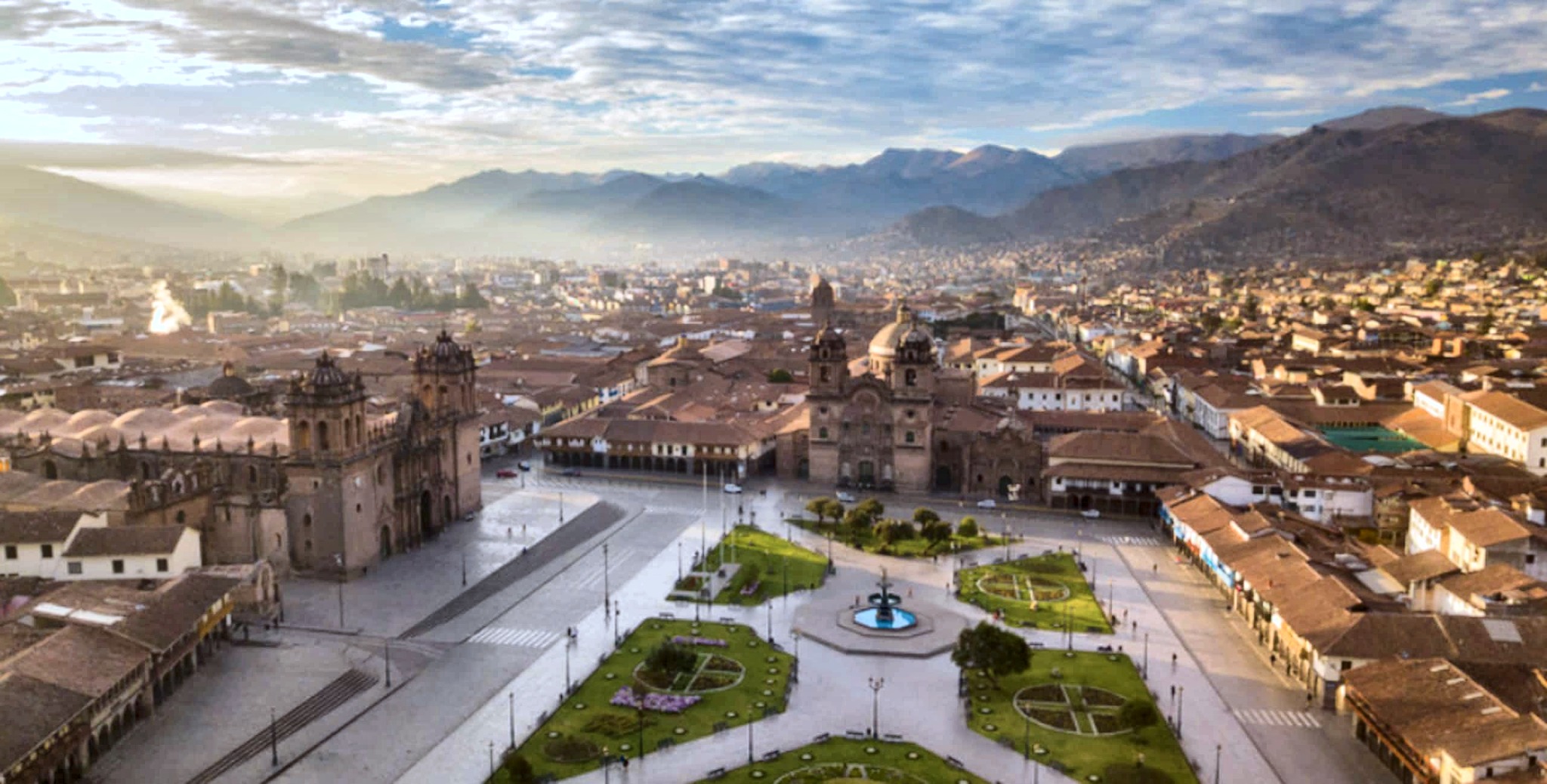 Golden light over the Plaza de Armas (establishing shot)